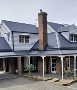 Cleaned and painted metal roof by Dave's Roof Services